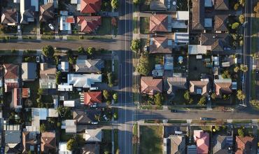 an aerial view of a neighborhood and street