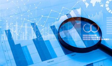 a magnifying glass and charts 