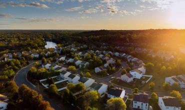 Aerial view of a suburban neighborhood at dusk