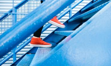 orange shoes on a blue staircase