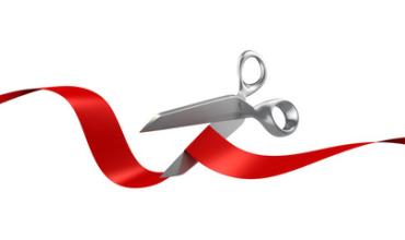 a red ribbon with scissors 