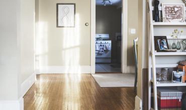 an entryway with a photo on the wall