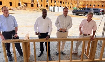 A group of people standing in a construction site