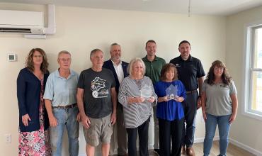 Spindale Neighborhood Revitalization Recognized for Significant Community Impact The Spindale Neighborhood Revitalization team accepting their awards