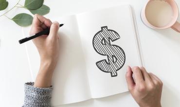 North Carolina to Gain $1.47 Billion in Affordable Housing Development A money sign drawn on a piece of paper