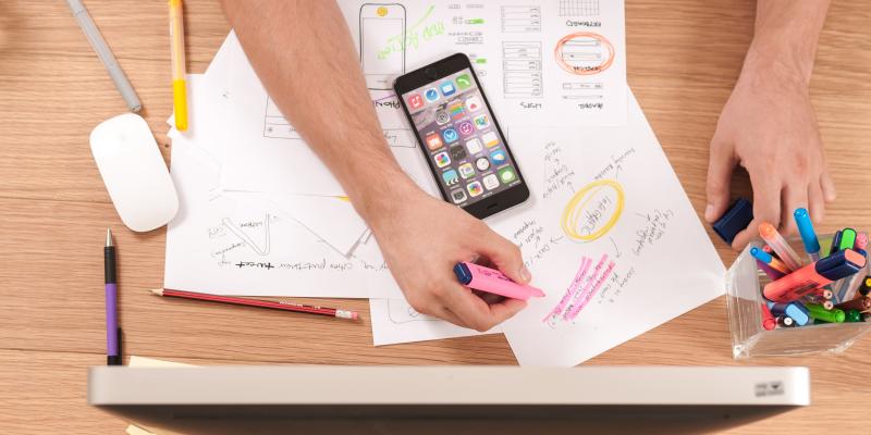 A person working with papers at a desk