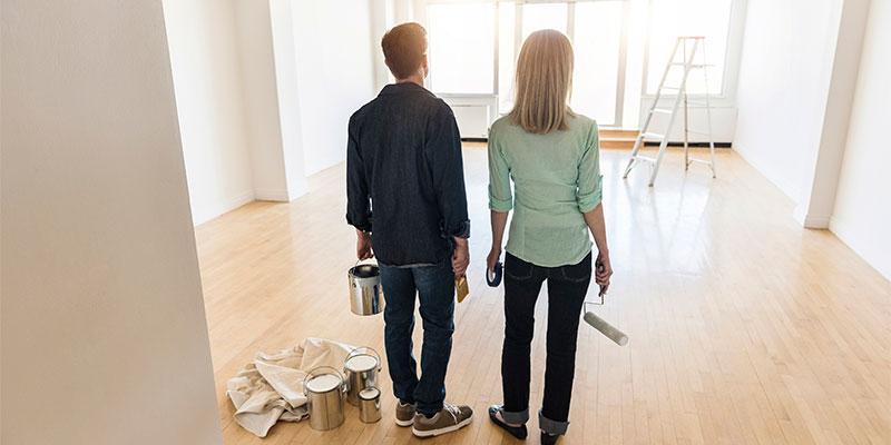 Homeowners painting a room