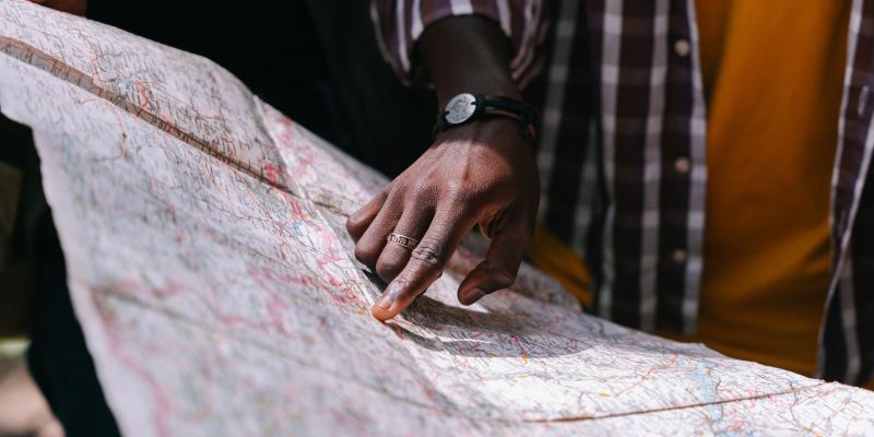 Volunteer pointing at a map